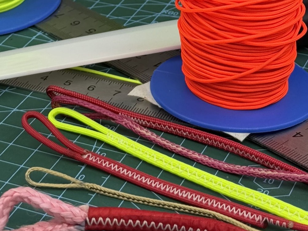 Repairing red and blue paraglider